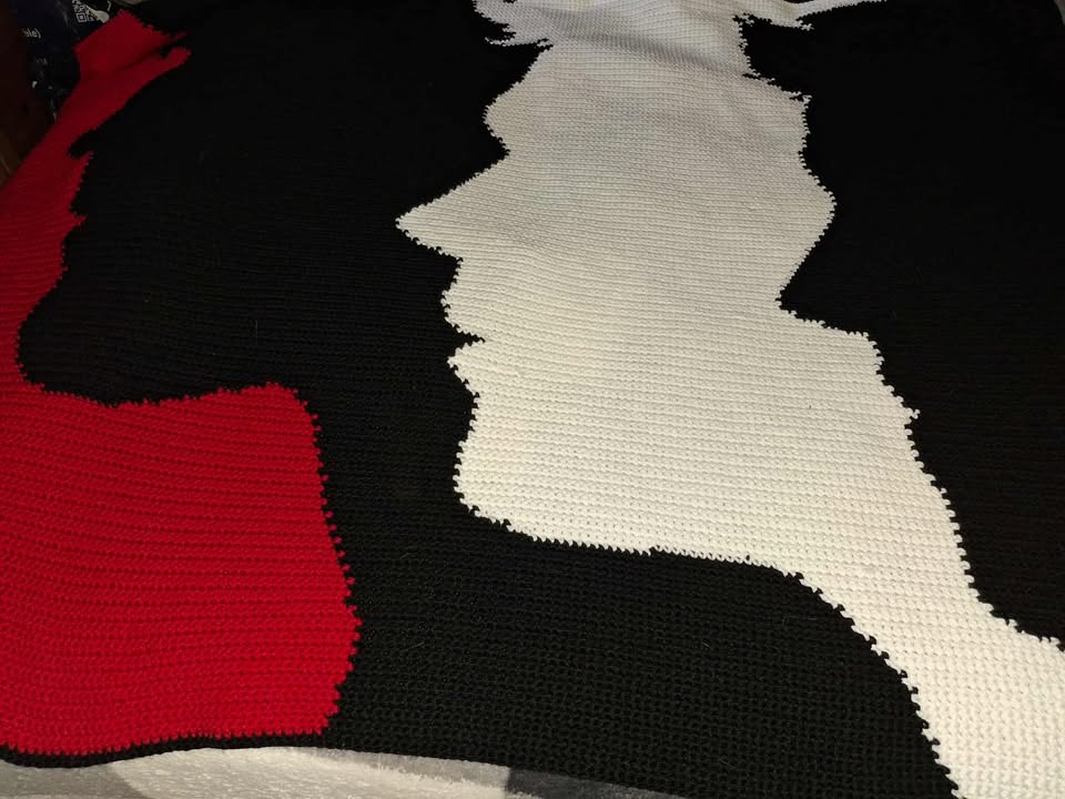 A graphic image of the Supernatural Trio Silhouettes Crochet Graphghan Pattern, featuring silhouettes of three characters from the Supernatural TV series in red, white, and black colors. Design by Geeky Graphghans. Crocheted by Debbie Mccamond