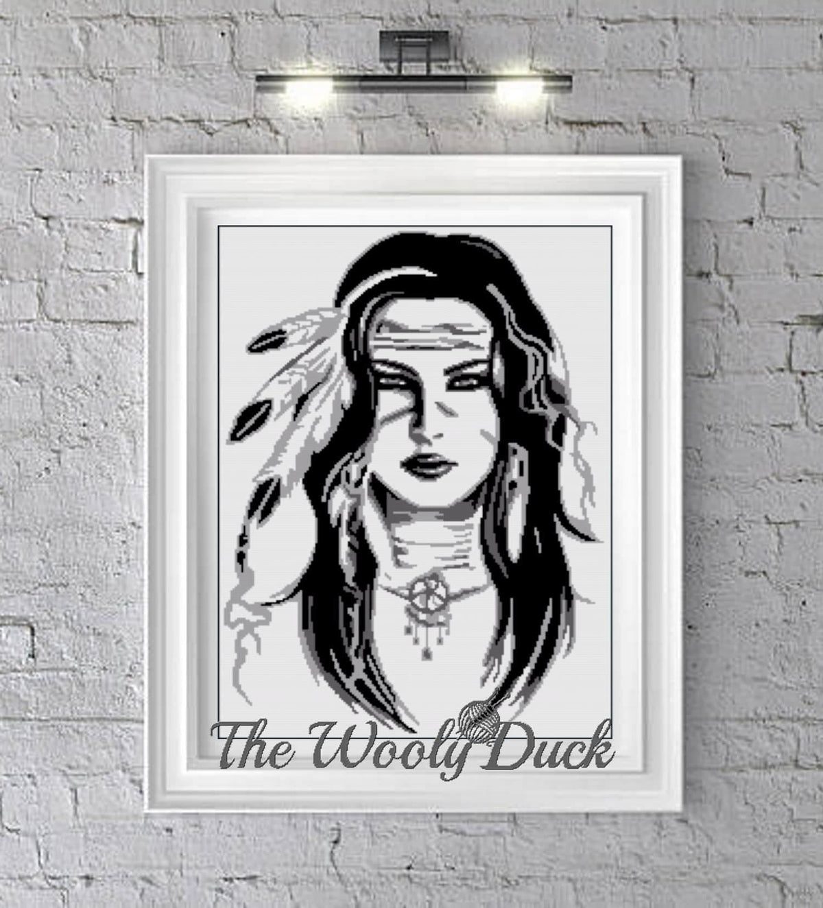 A black and white image of a graphghan pattern featuring a character's face, with the text 'The Wooly Duck' at the bottom, displayed on a wall.