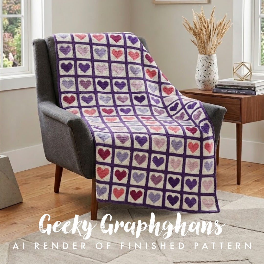 A cozy gray armchair in a bright room draped with a knitted heart-pattern throw blanket. The blanket features purple grid lines and alternating heart squares in purple, pink, red, and lavender.