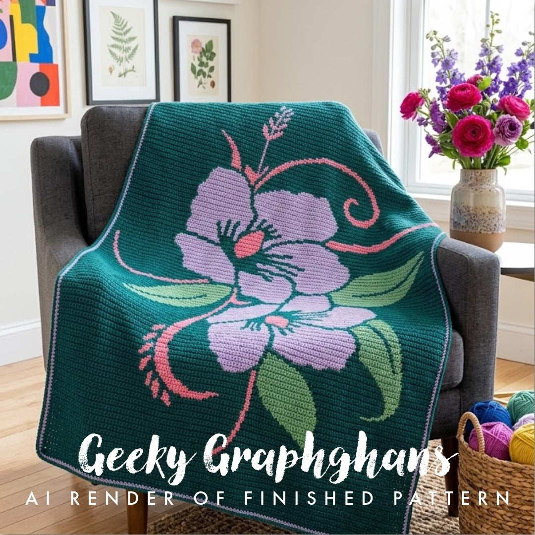 A crocheted or knitted floral throw blanket draped over a gray armchair in a bright room. The blanket has a dark teal background with a large lavender flower, pink accents, and green leaves. Tahiti Crochet Graphghan Pattern