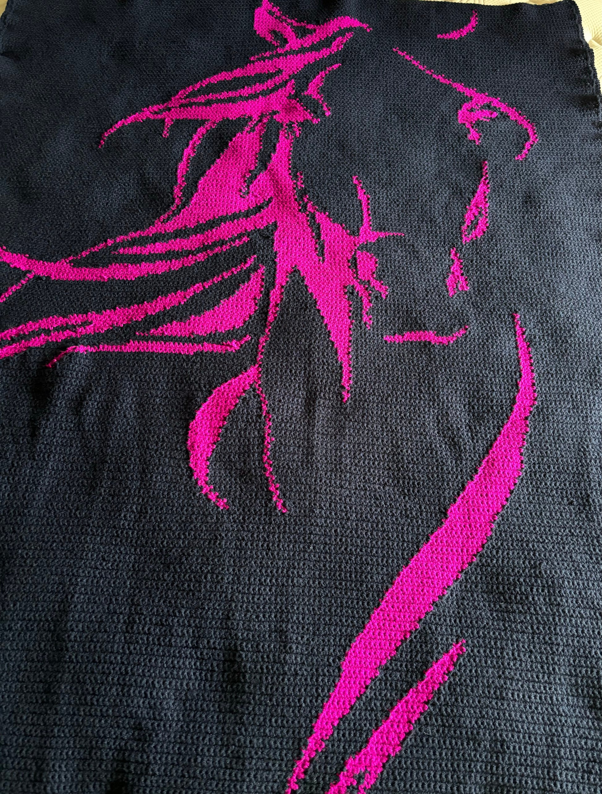 Black fabric with pink horse design