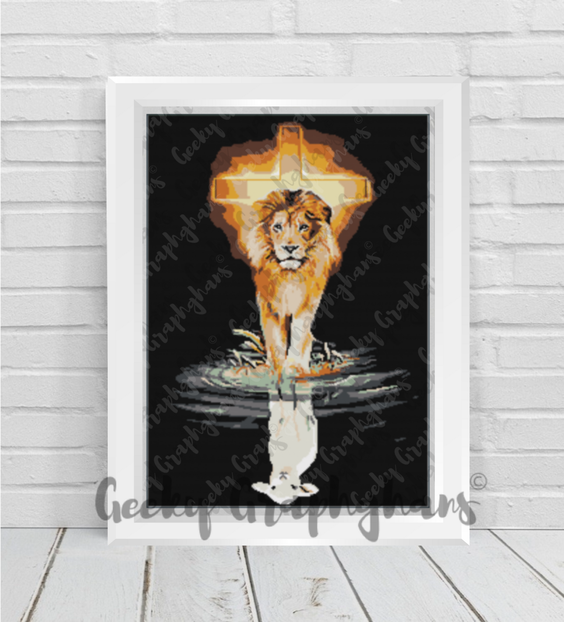 Framed artwork of a lion standing in water with a geometric light fixture above, on a white wooden floor. The Lion And The Lamb Crochet Graphghan Pattern by Geeky Graphghans