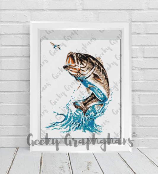 Framed artwork of a fish biting a hook on a wooden floor. Sea Bass crochet graphghan pattern by Geeky Graphghans
