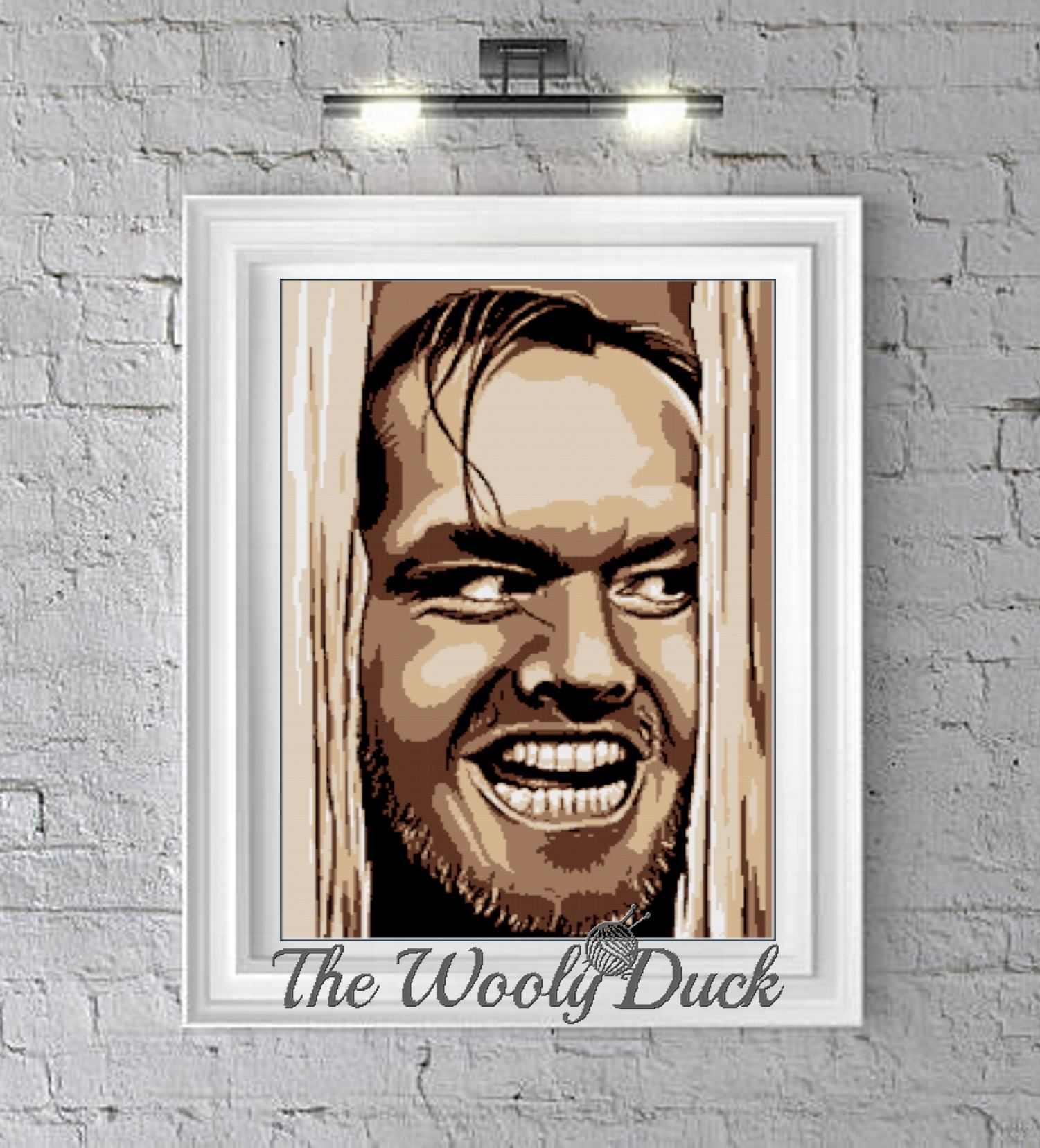 A crochet pattern of a character resembling Jack Nicholson from the movie 'The Shining', displayed in a frame, with the text 'THE WOOLY DUCK' at the bottom.
