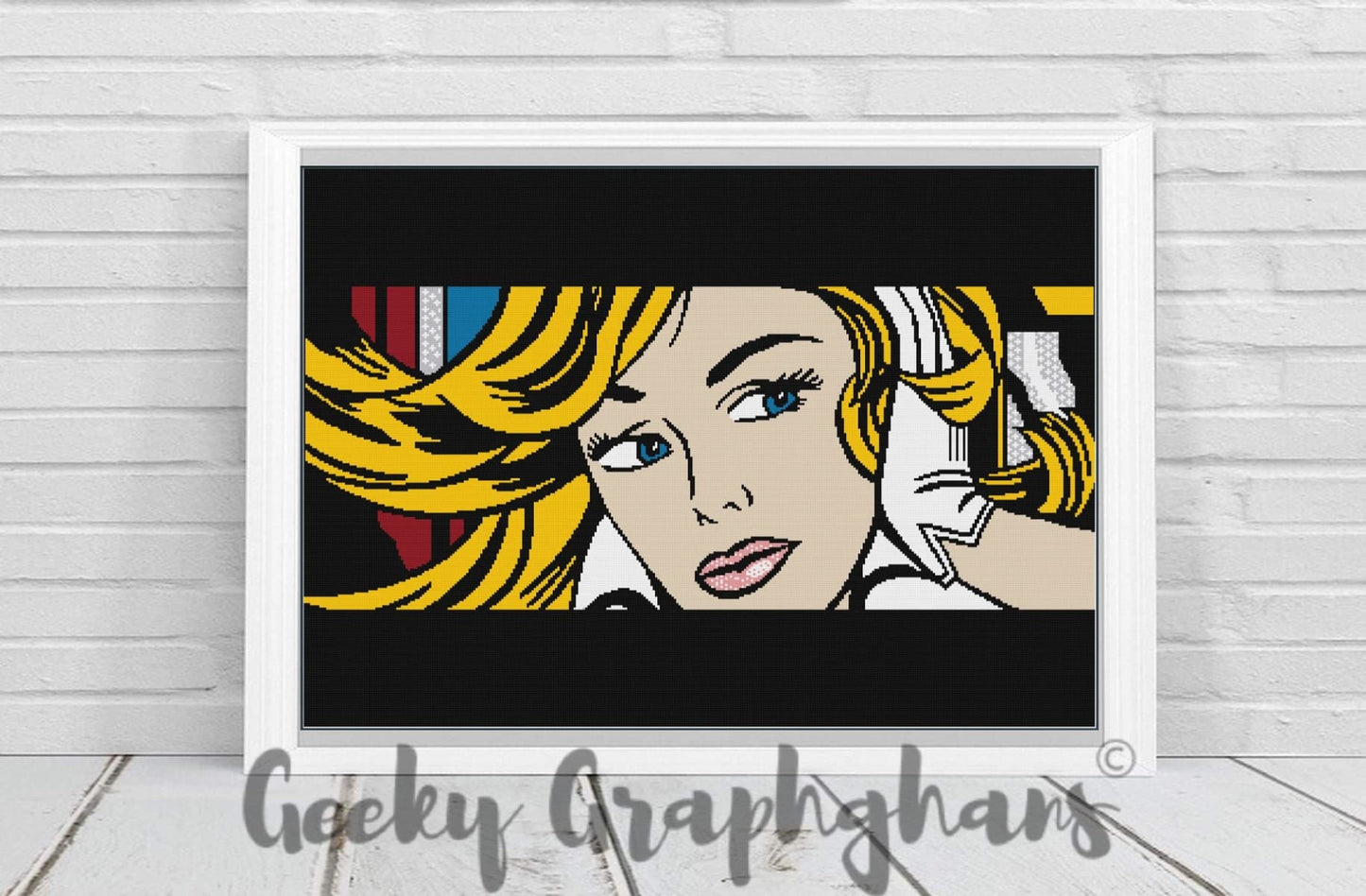 A crochet pattern display featuring a colorful graphic design with a pop art style, framed in a white border, with the brand name 'Geeky Graphghans' written in a script typewriter font.