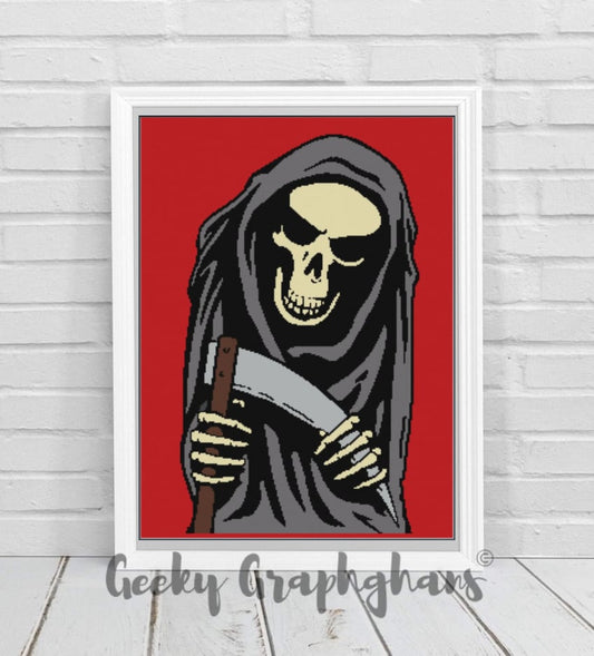 A crochet graphghan pattern featuring a graphic of the Grim Reaper with a red background, held against a white brick wall.